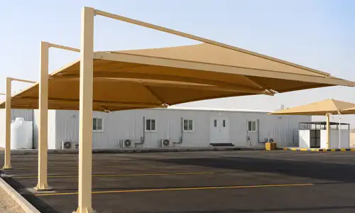 Cantilever-style parking shade installed outdoors and used in covered parking structures in Saudi Arabia.