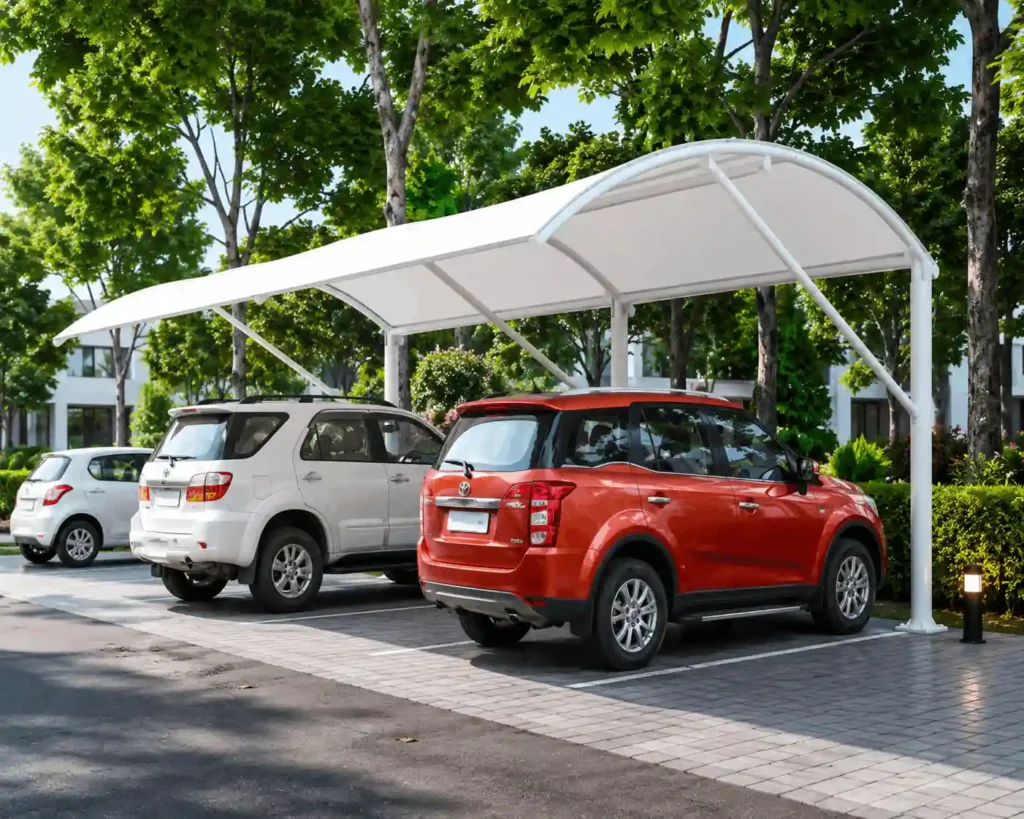 Arched cantilever parking shade installed over multiple vehicles by car parking shade manufacturers in KSA.