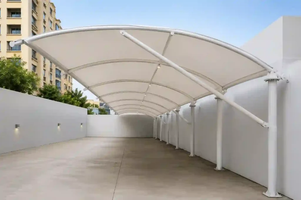 Arched residential parking shades in Riyadh installed along a driveway with a durable fabric canopy structure.