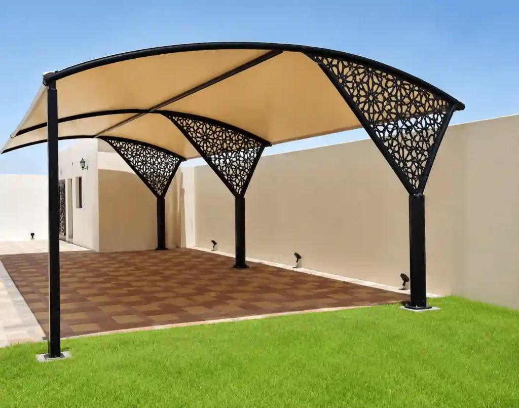 Decorative cantilever shade structure with artistic metal detailing.