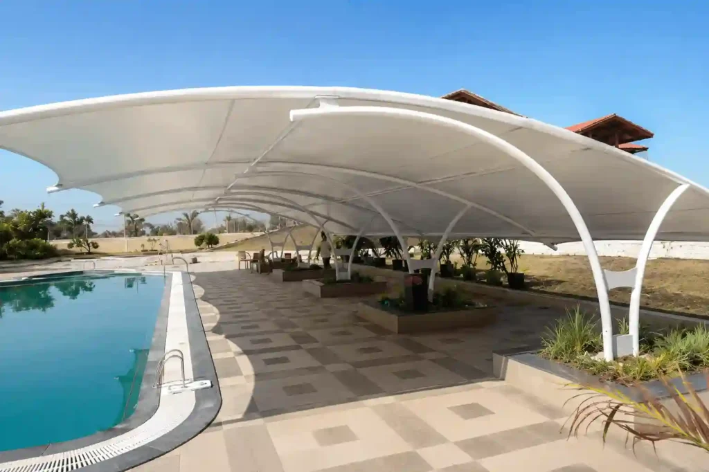 Luxury residential parking shades in Riyadh with modern curved design.