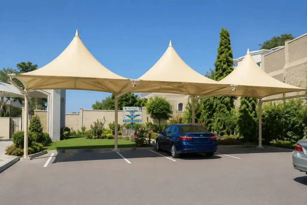 Pyramid-style villa parking shades Riyadh installation with tensile fabric canopies providing covered vehicle parking.