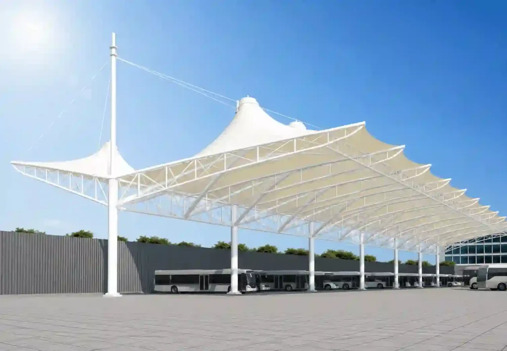 Large tensile membrane canopy used for vehicle parking protection.