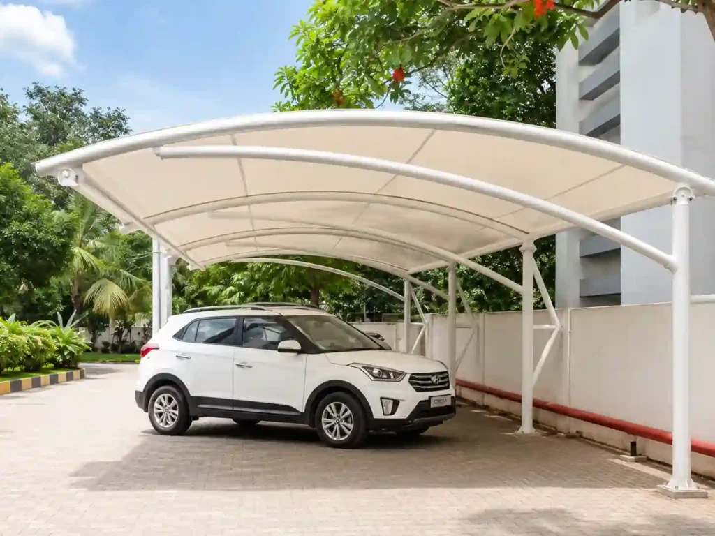 Curved carport canopy providing car parking shade installation in Saudi Arabia.