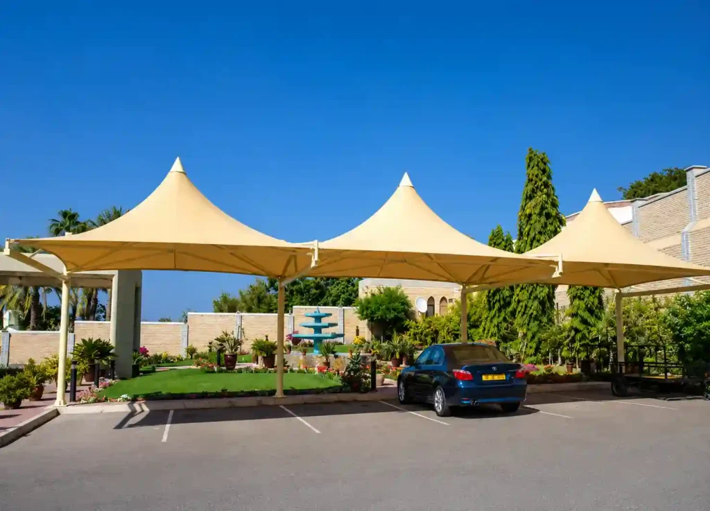 Premium pyramid car parking shade providing covered parking for multiple vehicles.
