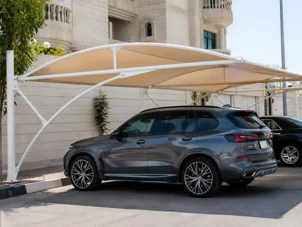 Residential car parking shade canopy installed for vehicle protection, demonstrating professional car parking shade installation in Saudi Arabia.