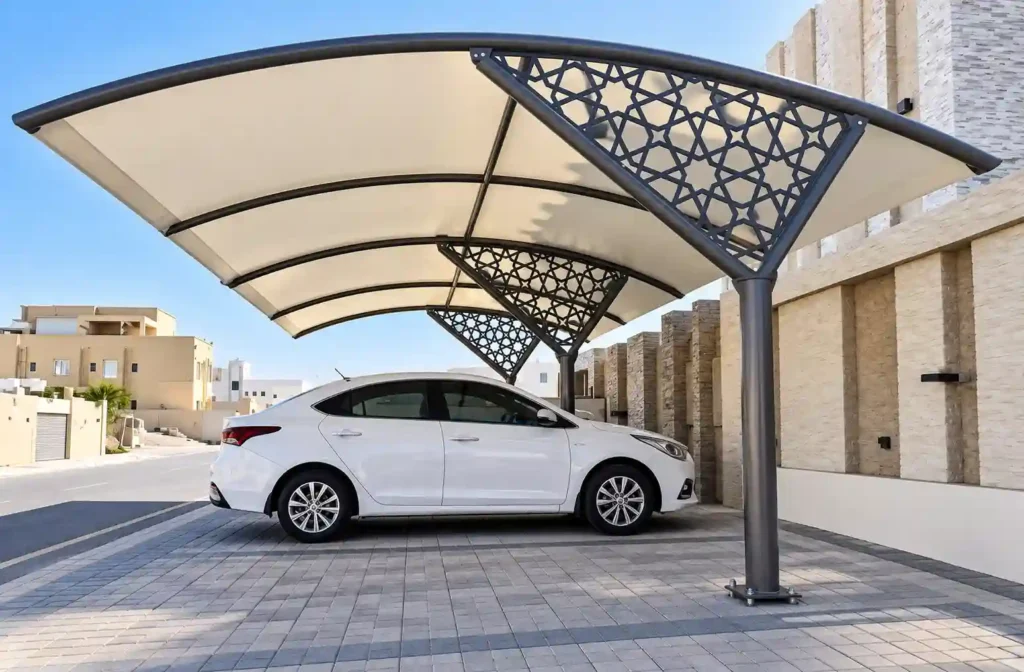 Decorative car parking shade with patterned structural detailing.